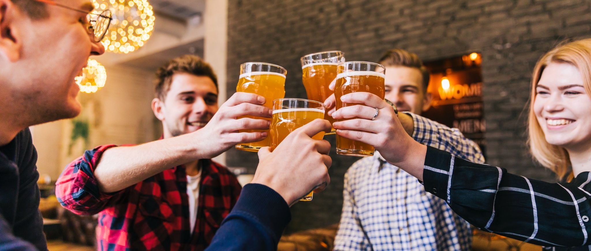 Group Of Friends Enjoying Beer In A Kw Microfesthallen